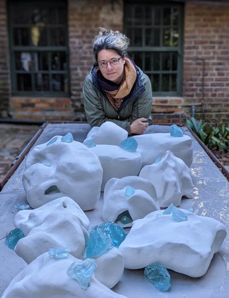 Lysanne Larose with a collection of Glacial Erratic prototypes