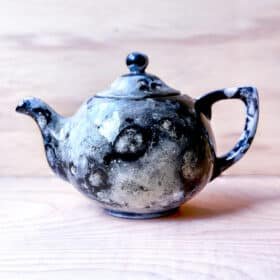 Amy Rae Hill - How to use low-fire pottery glaze to paint a lunar crater design on a teapot.